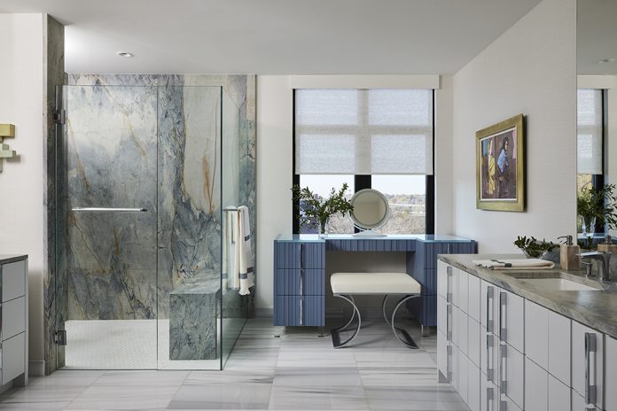 open concept bathroom with marble shower