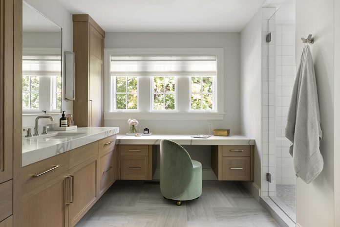 velvet green stool in modern bathroom and vanity with three windows