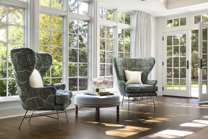 large windows letting light into traditional living room set