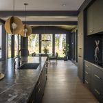 8 Dreamy Luxury Kitchens to Inspire Your Next Home Project This kitchen features clean lines, a neutral palette, and bold light fixtures.