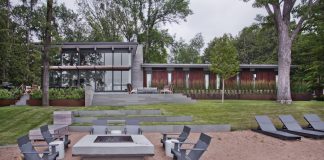 Lakeside Living: Cascading Terraces Reimagine Backyard Deck Design Casacading terraces create distinct zones for outdoor enjoyment paired with lake views.