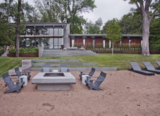 Lakeside Living: Cascading Terraces Reimagine Backyard Deck Design Casacading terraces create distinct zones for outdoor enjoyment paired with lake views.
