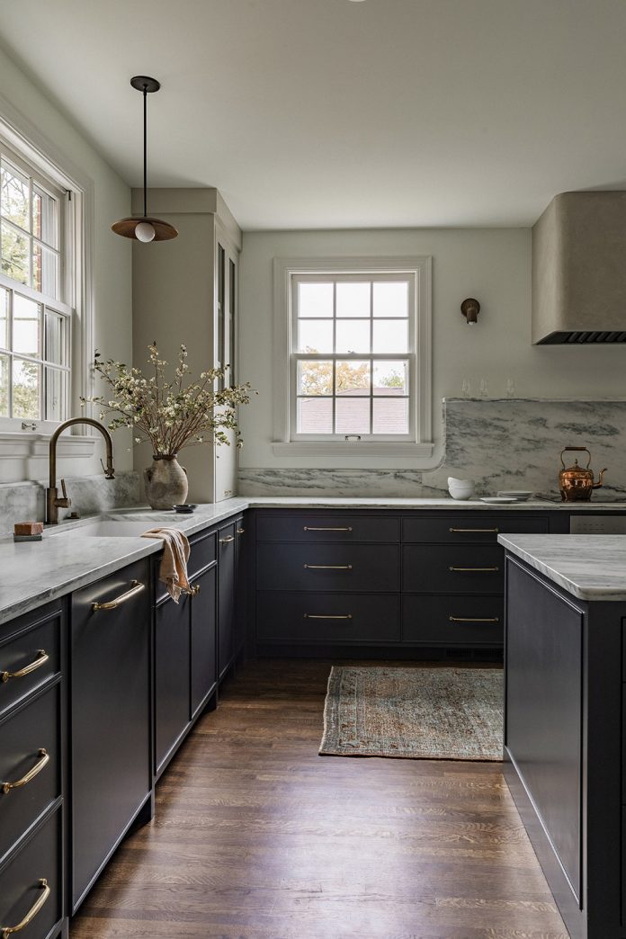 moody dark kitchen marble backsplash sink