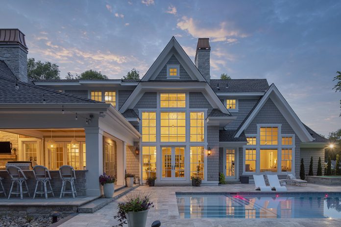 traditional home with pool and bar patio