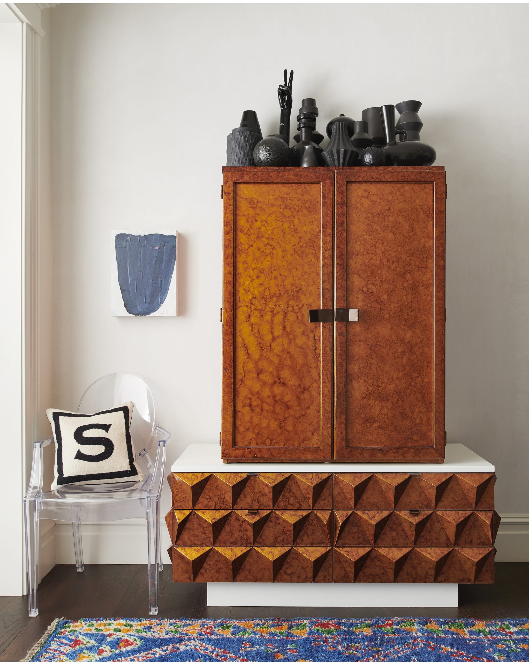 When considering adding vintage style to your spaces, Heather Peterson recommends pairing something with its opposite to call attention to the qualities of both. "I particularly love the pairing in the entry, where a square and heavy armoire is paired with a curved and ethereal ghost chair," she says of one of her projects.