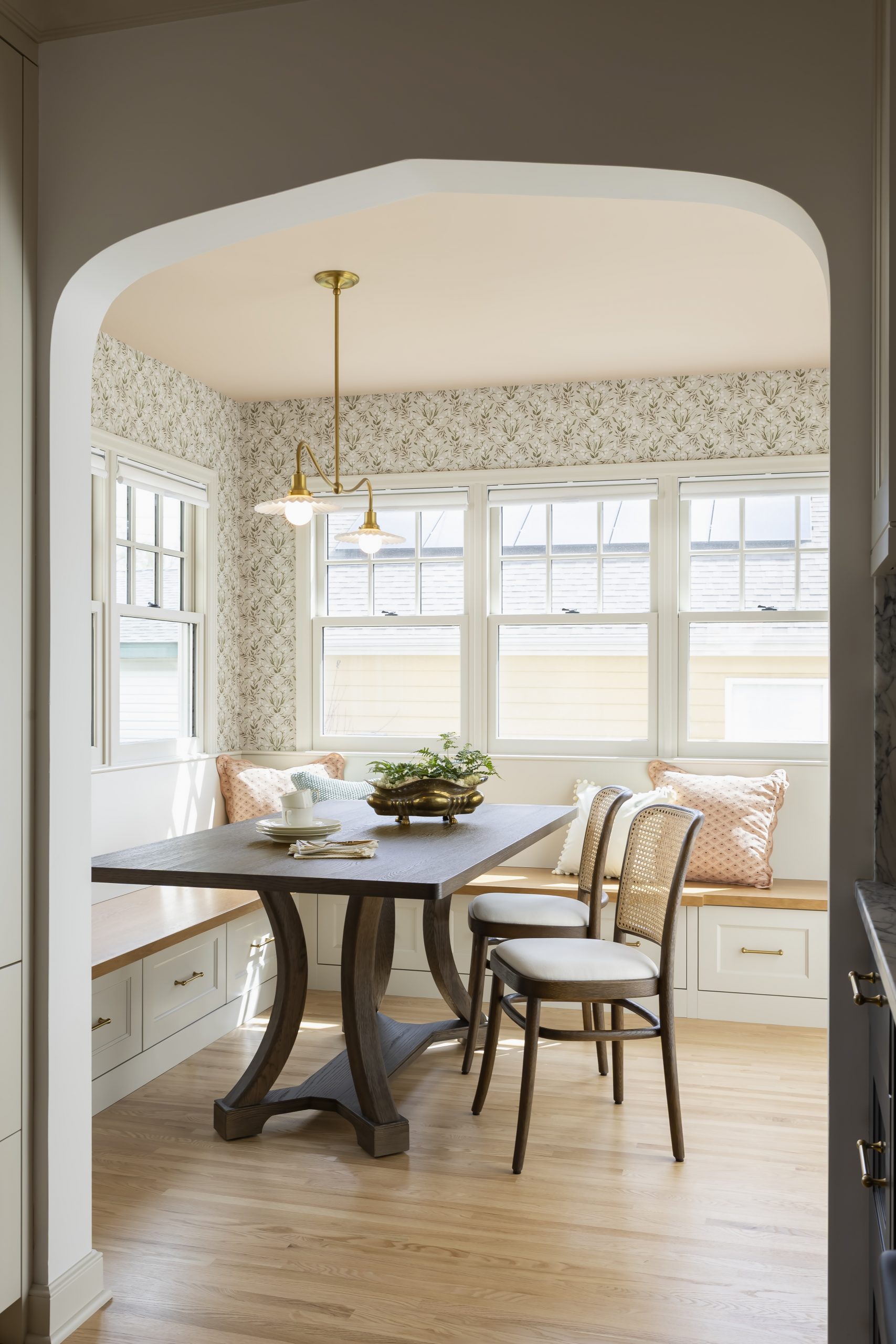Banquette seating makes the dining room cozy, and the new windows allow light to stream in throughout the seasons.