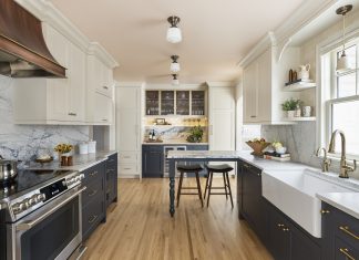 Hues of deep charcoal and creamy white pair with brass and heavily veined quartzite to create a space that brings color, texture, and visual details together. The Form From Form custom copper and brass hood is an especially showstopping piece.