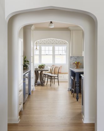 Upon entering the home, a series of perfectly aligned archways lead to the kitchen&mdash;an original detail from when the home was built.