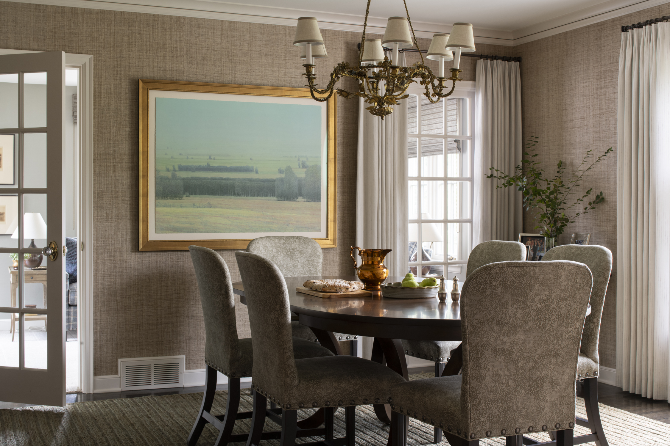 The brass chandelier in this Edina dining room was originally spotted through the window at Clarabel Vintage on a day the shop was closed.