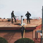 3 Midwest Roofing Repair Pros You Can Trust Men working to repair house roof