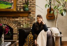 Lidia Valdivia Transforms Homes into Colorful Places of Refuge Lidia Valdivia sits in her newly remodeled living room, where raised the previously sunken space and added terracotta floors, and skylights and wood beams to the ceiling, creating an open, inviting atmosphere. Neutral Roman Clay walls allow artwork—some from her travels and home in Nicaragua, some created by her partner—to shine.