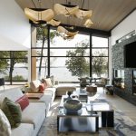This Modern Minnesota Lake Home Is a Luxurious Sanctuary Natural light pours into the great room of this modern Minnesota lake home, complete with stunning lake views and sculptural lighting.