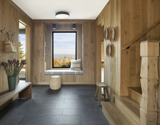 The design-build team collaborated to source reclaimed white oak wood paneling for the interior, to infuse the space with the feeling of being outside with nature, even within the comfort of the cabin, Jurvakainen notes.
