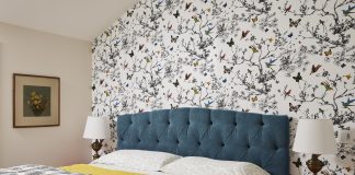 A Charming Guest Suite Leans into Color Schumacher wallpaper, a custom velvet headboard, and colorful nightstand make this guest suite stand out.