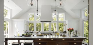 The kitchen island came from an unexpected place: a piece of furniture the homeowners had been holding in storage for several years, hoping it could someday be used in their house. It was modified to be part of the island, and is now a standout feature of the room.