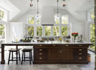 The kitchen island came from an unexpected place: a piece of furniture the homeowners had been holding in storage for several years, hoping it could someday be used in their house. It was modified to be part of the island, and is now a standout feature of the room.