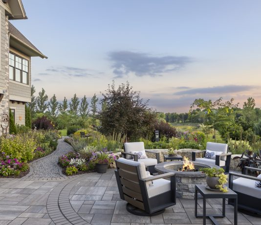 Cultivated by Hand: A Thriving Landscape Frames This Minnetrista Home Outdoor patio with scenic views of surrounding landscape. July 6, 2026