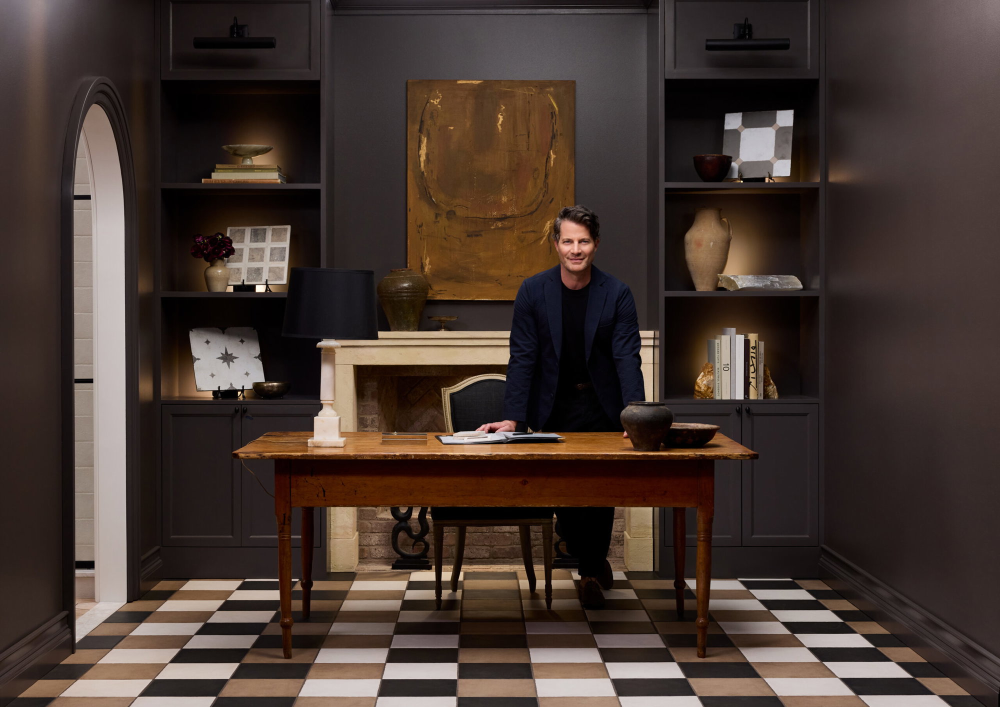 Nate Berkus stands in a study with tile from new tile collection in collaboration with The Tile Shop