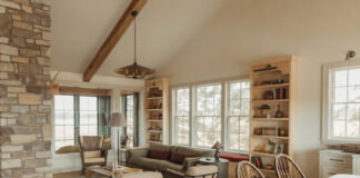 Modern Scandinavian Design Meets Country Sophistication in a Refined Farmhouse The great room’s birch bookshelves provide plenty of room to display the couple’s collection of knickknacks and family heirlooms.
