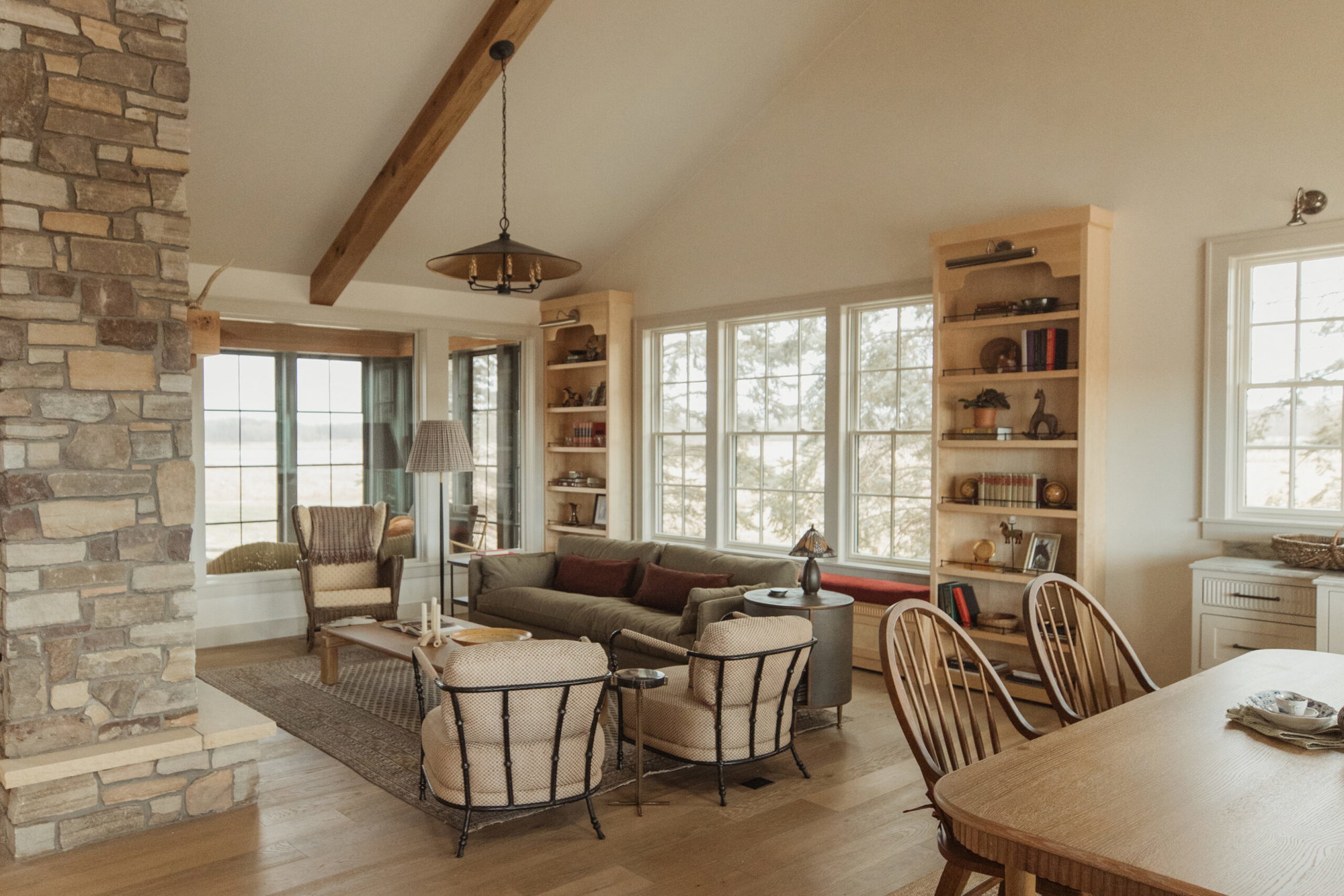 The great room’s birch bookshelves provide plenty of room to display the couple’s collection of knickknacks and family heirlooms.