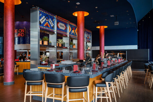 Vibrant tile mural above the second bar area at Ind&iacute;gena by Owamni. August 19, 2026