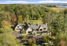 A Luxury Orono Home Inspired by California Wine Country Architecture Guests first walk up from the expansive drive to a raised courtyard, where warm stone, lots of greenery, and plenty of seating invite them to linger.