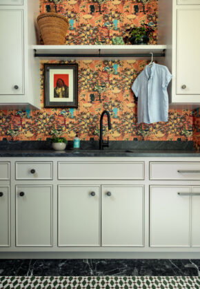 The design team hand-selected the tiles&mdash;made in Morocco&mdash;for the colorful laundry room, incorporating merlot, emerald, and cream hues to give the space an earthy, internationally inspired aesthetic.