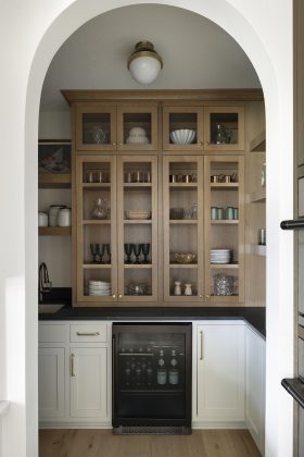 A custom hutch displays family heirlooms in this butler's pantry
