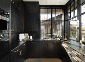 Natural pours into this butler's pantry to balance the dark cabinetry
