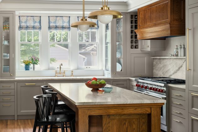 All-new cabinetry, appliances, and flooring elevate the once outdated kitchen, and natural light contributes to the feeling of openness.