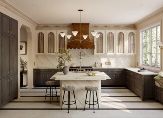 One of Cambria's new quartz designs, Quintessa, is characterized by creamy white and subtle sable-colored veins. It pairs well with natural woods, like in this kitchen.