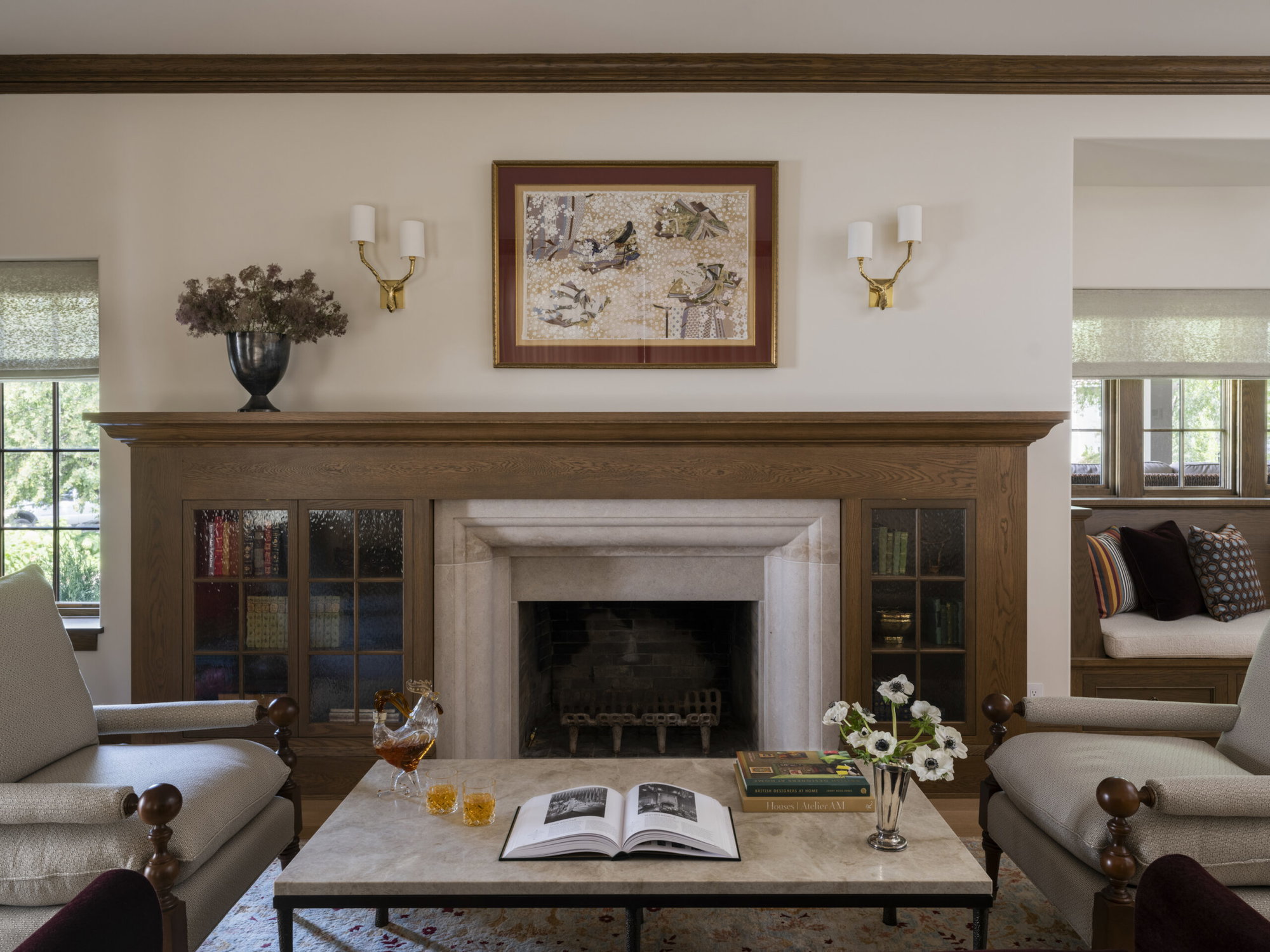 Library fireplace with new limestone mantel and custom white oak surround.