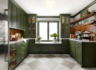 An Edina butler's pantry defined by deep-green cabinets