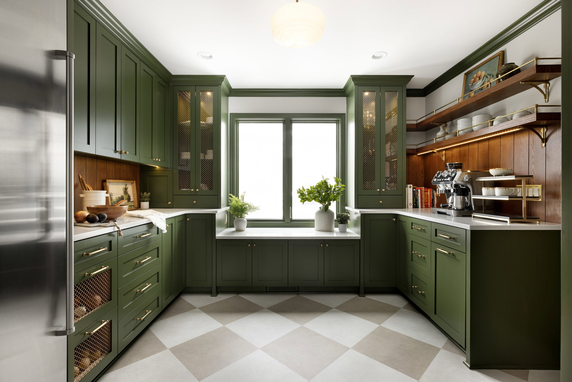 An Edina butler's pantry defined by deep-green cabinets